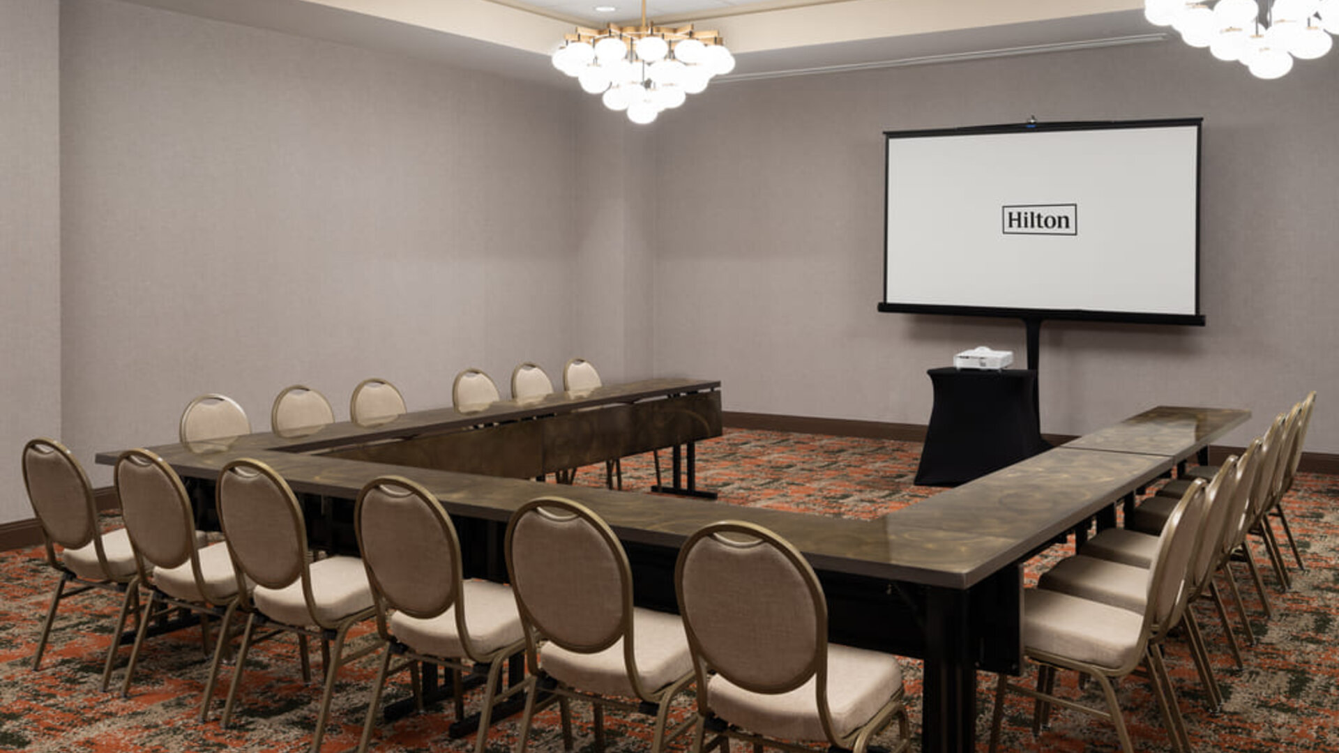 Meeting room configured in a U-shape layout, suitable for training sessions, workshops, and business meetings at Embassy Suites By Hilton Charleston Airport Convention Center.