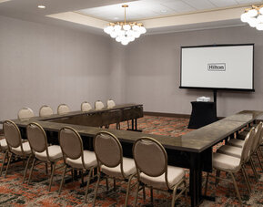 Meeting room configured in a U-shape layout, suitable for training sessions, workshops, and business meetings at Embassy Suites By Hilton Charleston Airport Convention Center.