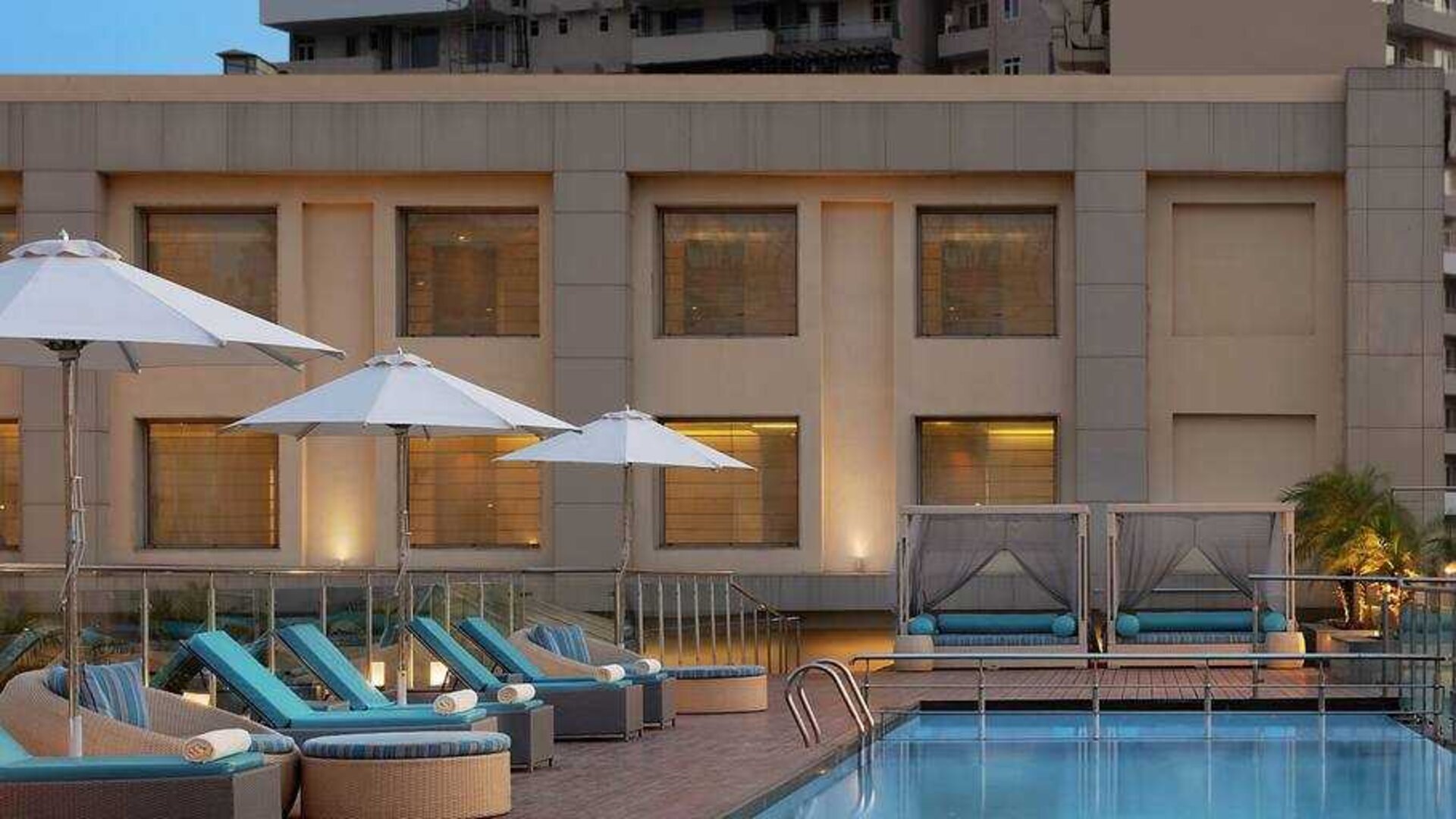 Relaxing outdoor pool area at the DoubleTree by Hilton Agra.