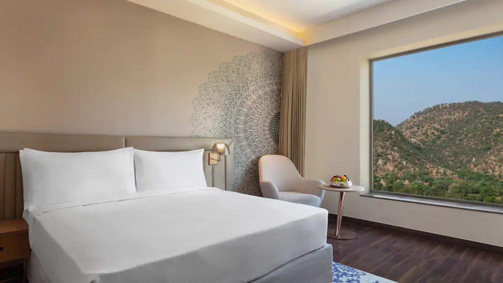 Hotel room with large window at the DoubleTree by Hilton Jaipur Amer.