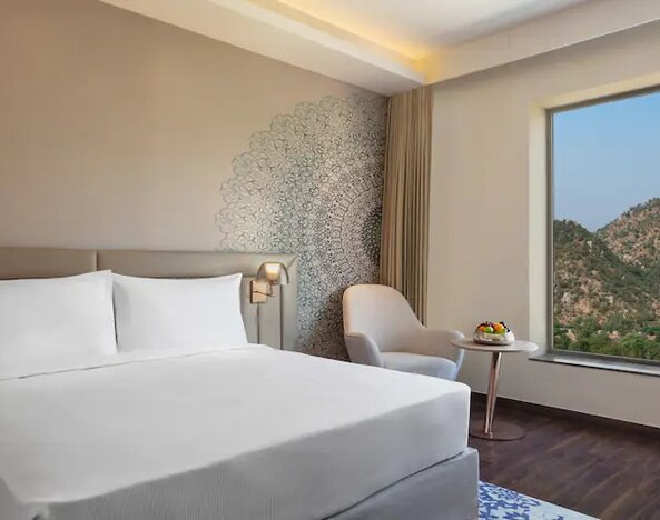 Hotel room with large window at the DoubleTree by Hilton Jaipur Amer.
