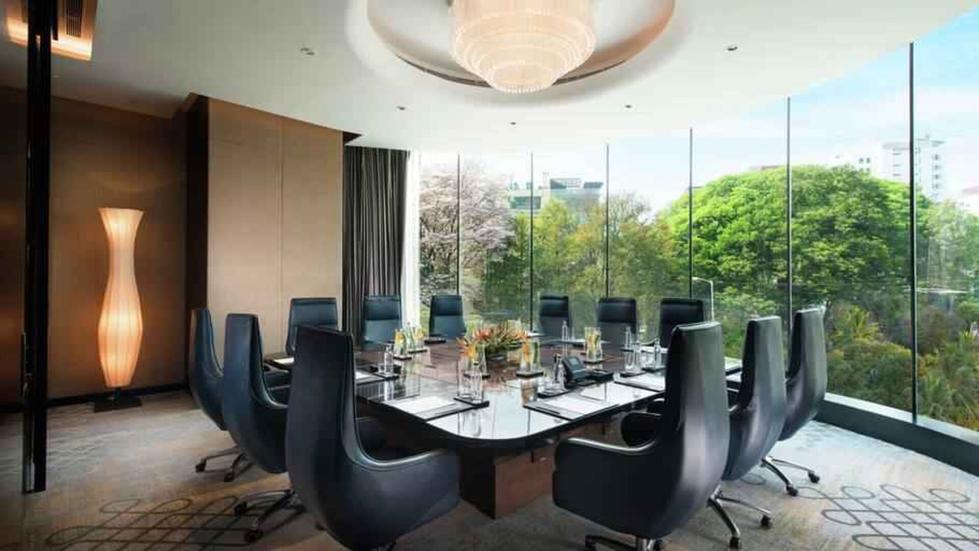 Meeting room with large window at the Conrad Bengaluru.