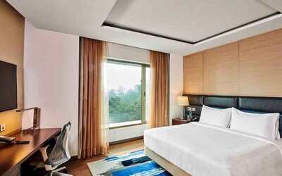 King bedroom with desk at the Hilton Garden Inn Lucknow.