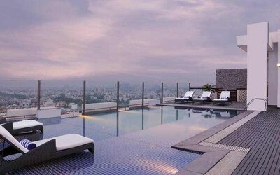 Relaxing outdoor pool at the DoubleTree by Hilton Gurugram Baani Square.
