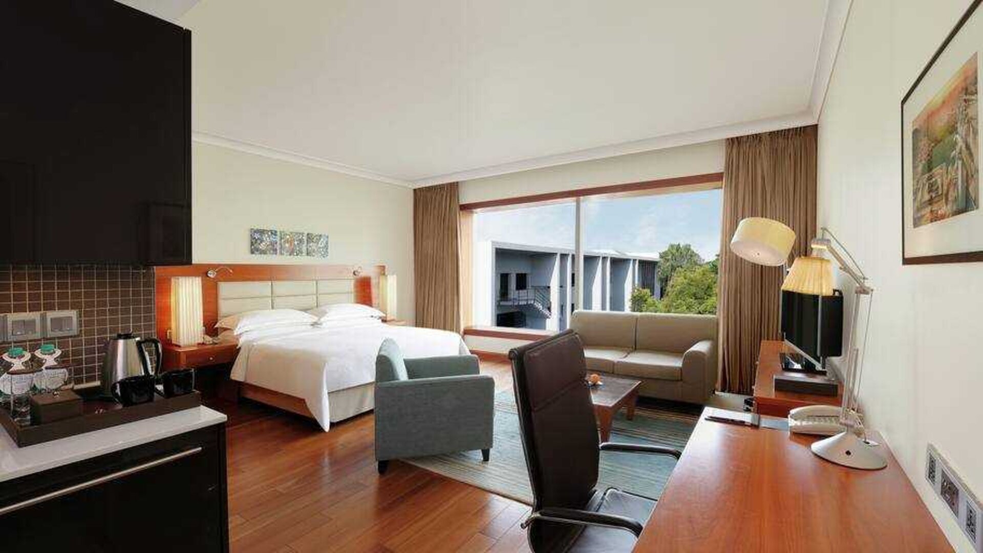 Spacious hotel room with working station at the Hilton Bangalore Embassy GolfLinks.