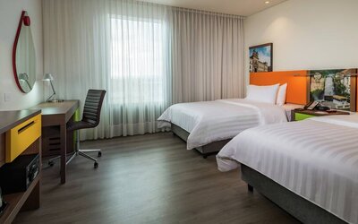 Twin room with working station at the Hampton by Hilton Bogota Airport.