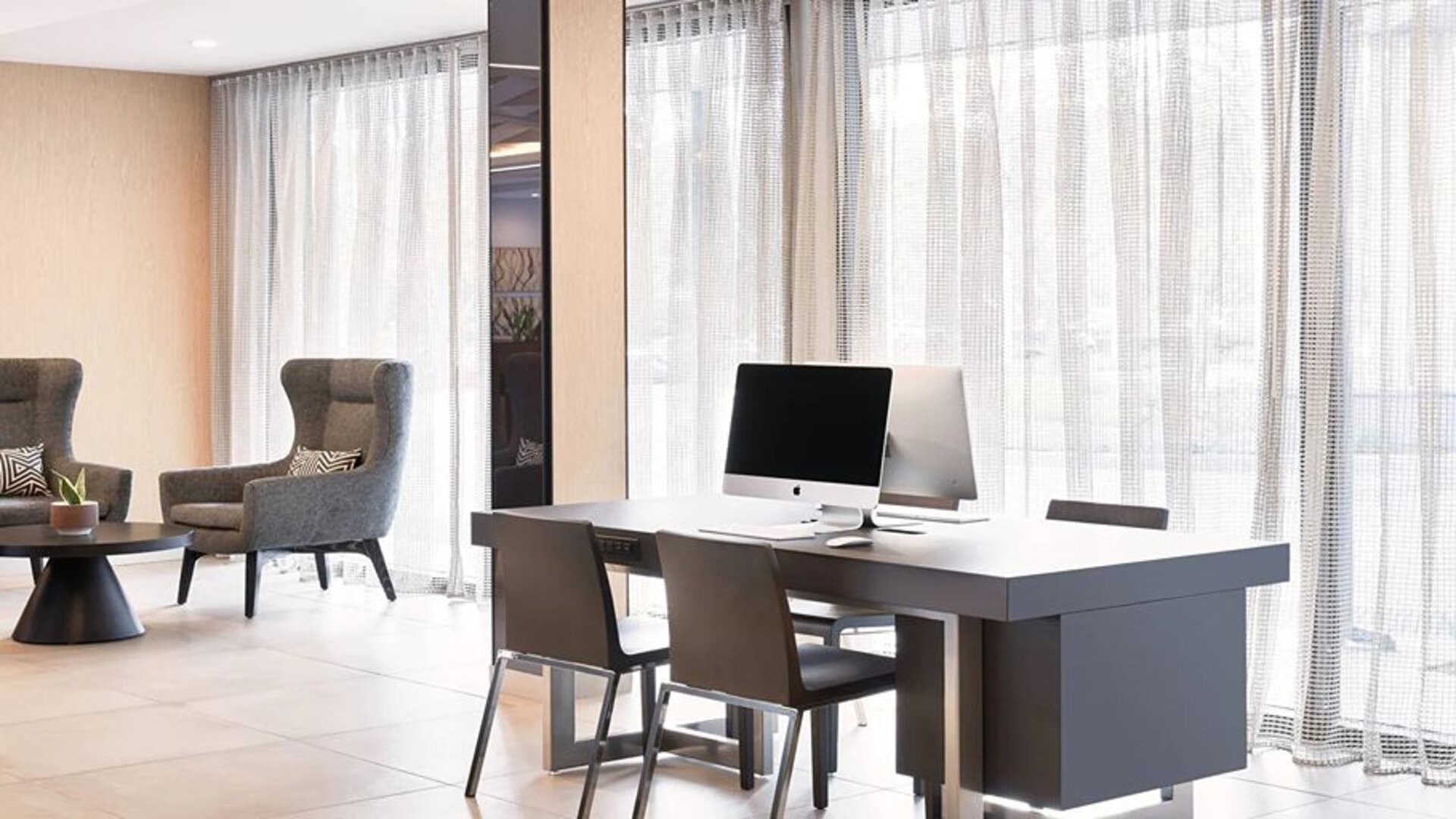 Business center with computers at the AC Hotel By Marriott Pleasanton.