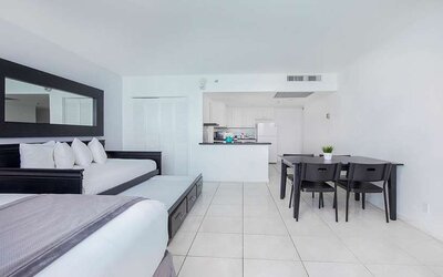 Hotel room with sofa and table at New Point Miami.