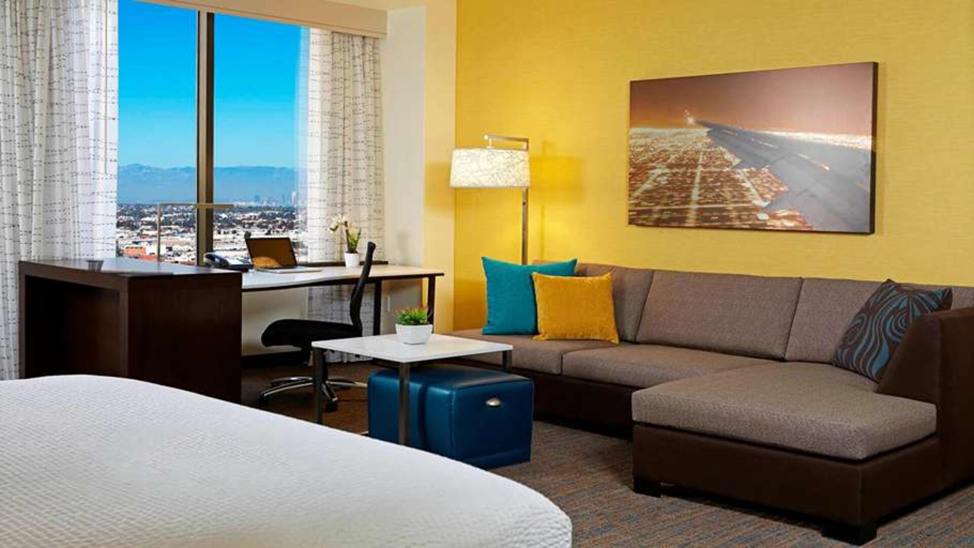 Living room perfect as workspace at Residence Inn By Marriott LAX Airport.