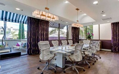 Bright meeting room with windows at Avenue Of The Arts Hotel.