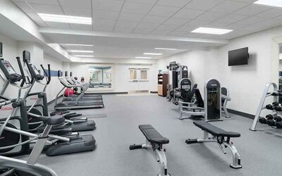 well equppied fitness center with weights and exercise equipment at Hampton Inn Philadelphia Center City-Convention Center.