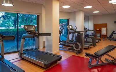 The hotel’s fitness center provides an array of exercise machines for guests.