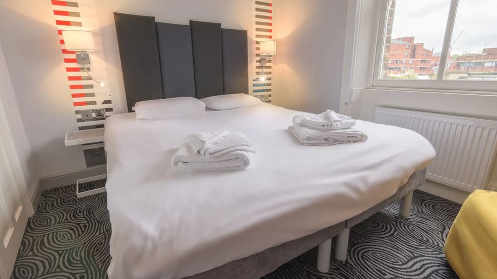 Zoomed in view of the king size bed in the guest suite room at the Victoria Inn, London, UK.