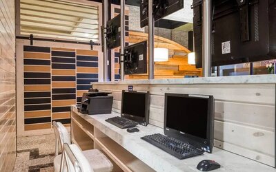 The hotel’s business center, with multiple workstations and office equipment.