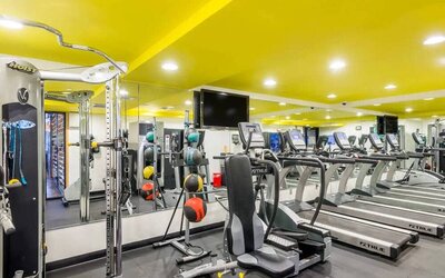 The hotel’s fitness room, furnished with a range of exercise machines.
