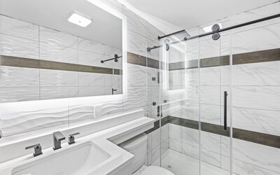 Guest bathroom with shower at Hotel Opus Bronx.