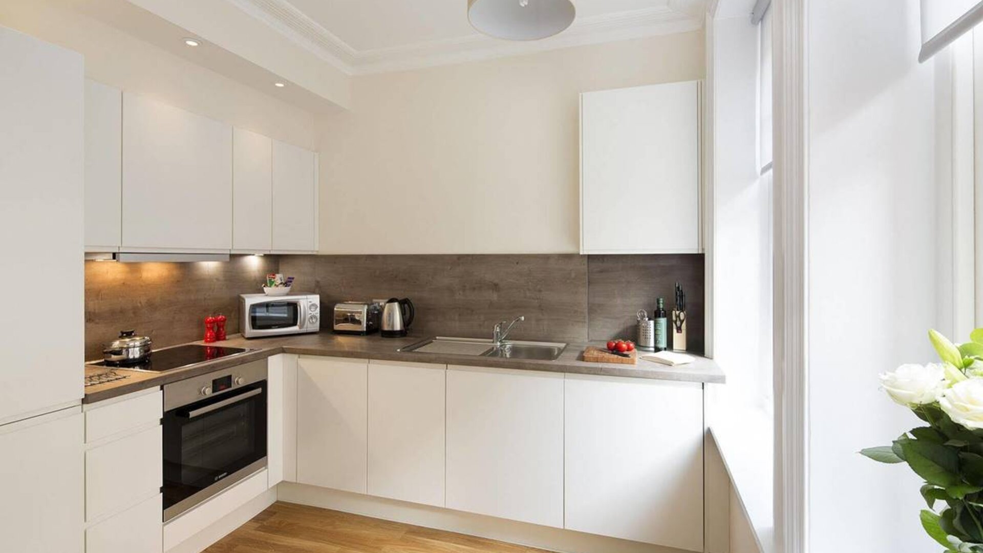 The Hammersmith One’s kitchen, including kettle, oven, microwave, and toaster.