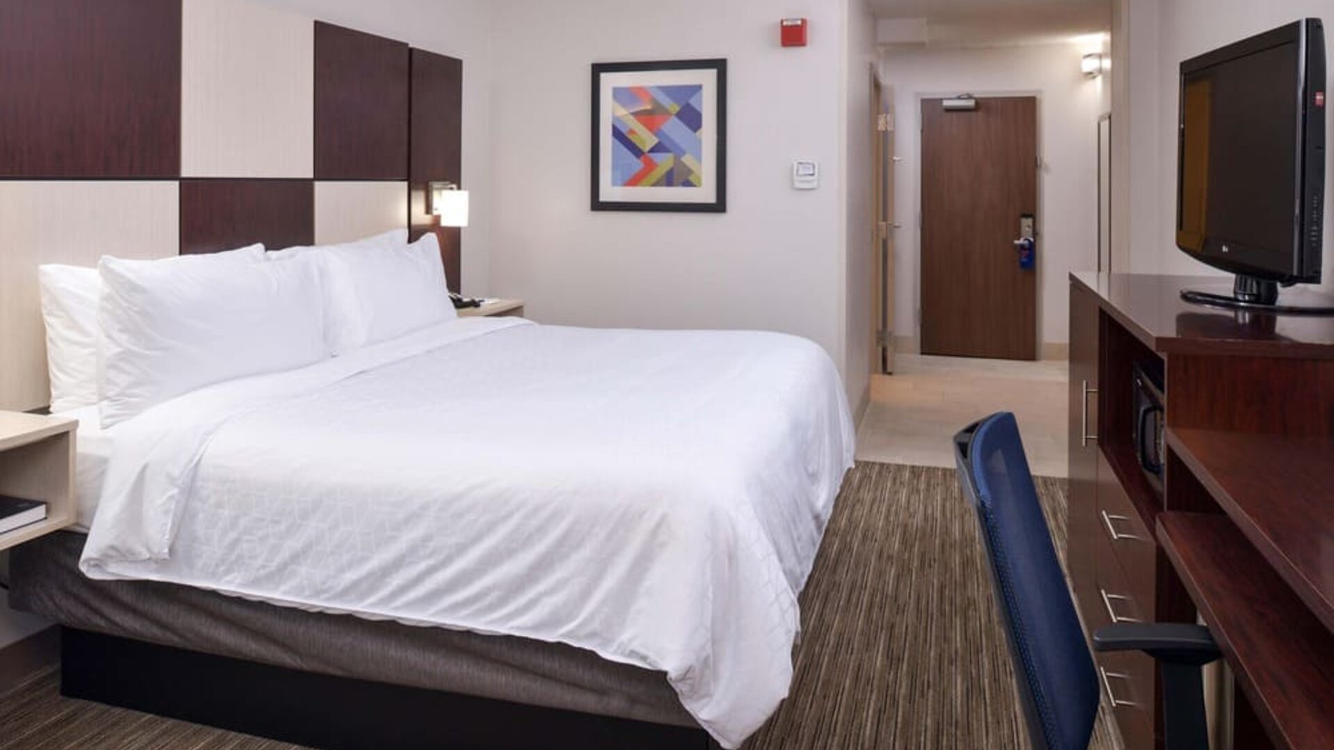 Delux king bed with TV and business desk at Holiday Inn Express Towson Baltimore N.