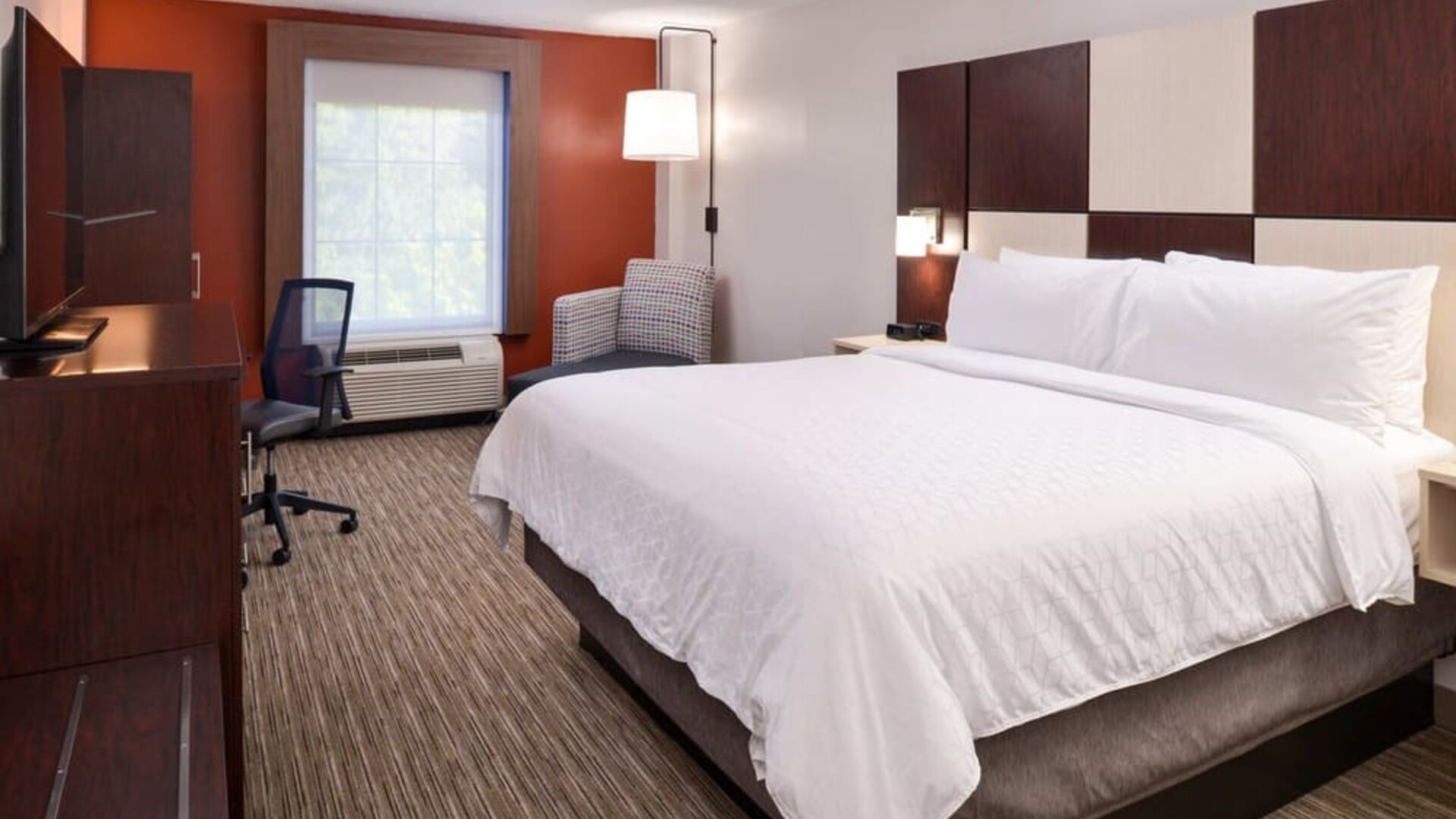 Spacious king bedroom with TV and work station at Holiday Inn Express Towson Baltimore N.