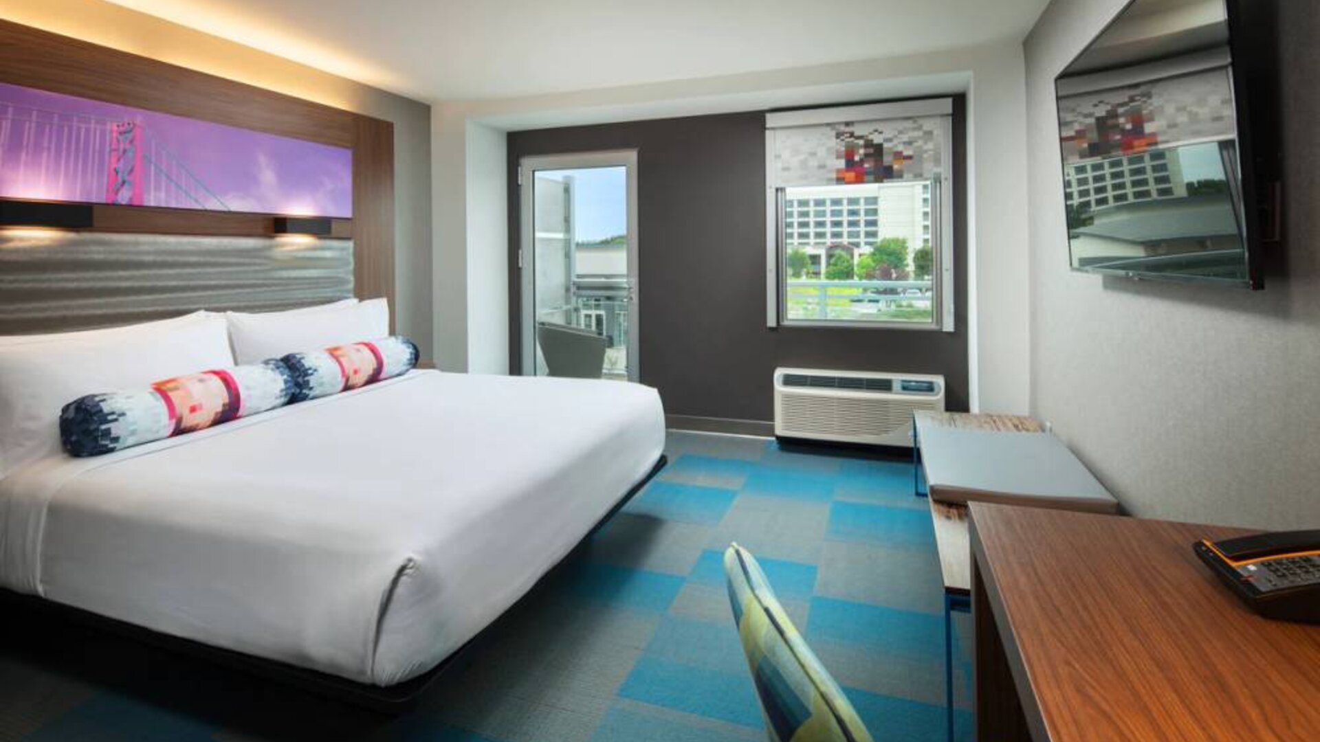 Day use room with balcony and work desk at Aloft SFO.