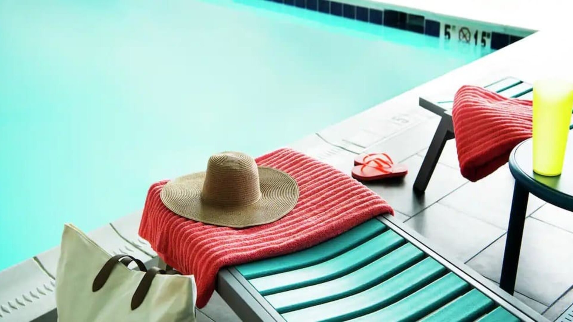 Lovely pool area with seating at Home2 Suites By Hilton Dallas Medical District Lovefield.