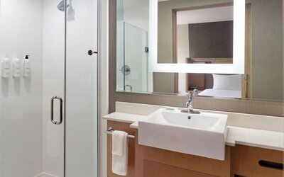 Private guest bathroom with shower at SpringHill Suites Atlanta Northwest.