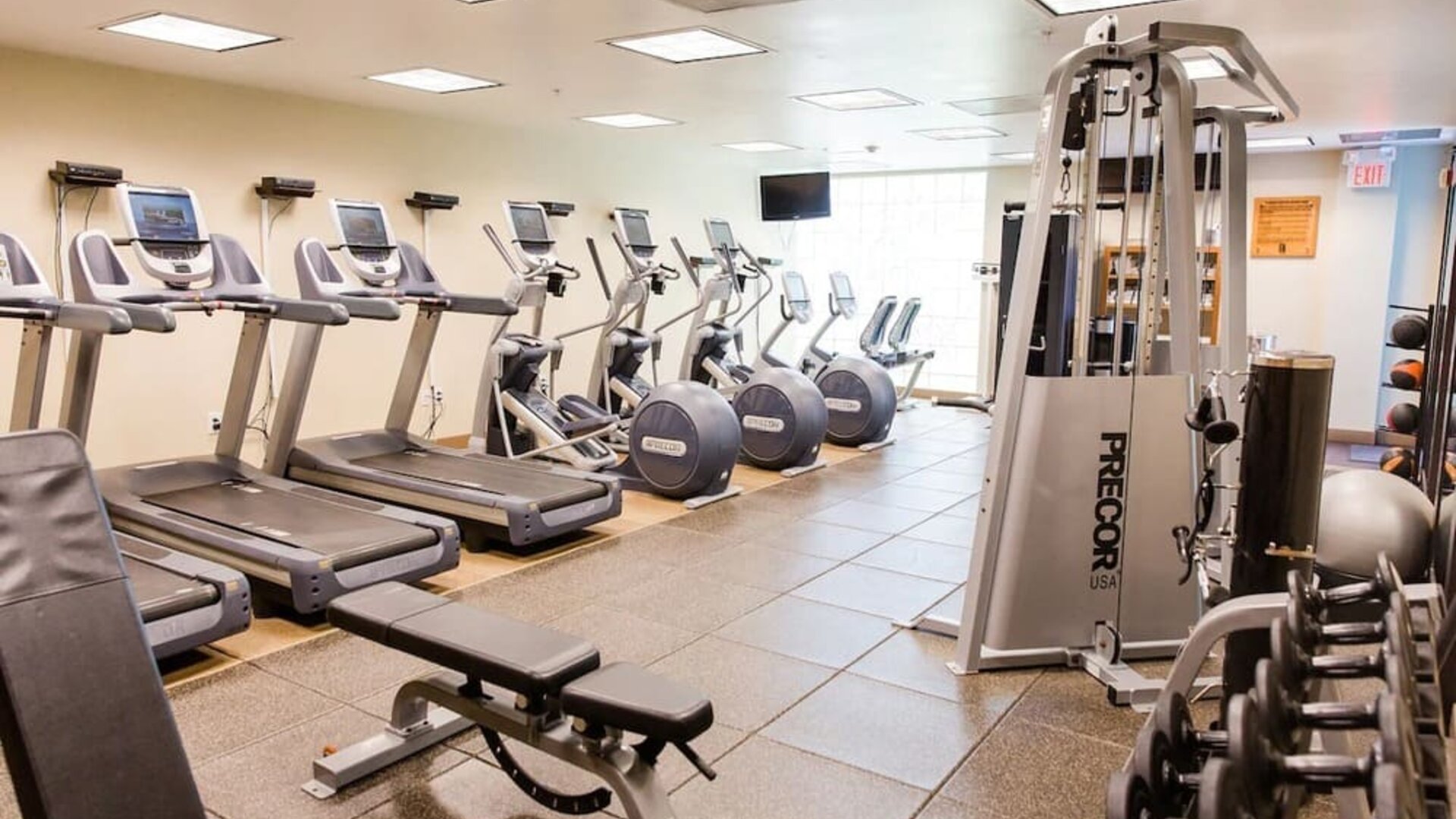Fitness center with treadmills at Embassy Suites By Hilton West Palm Beach Central.