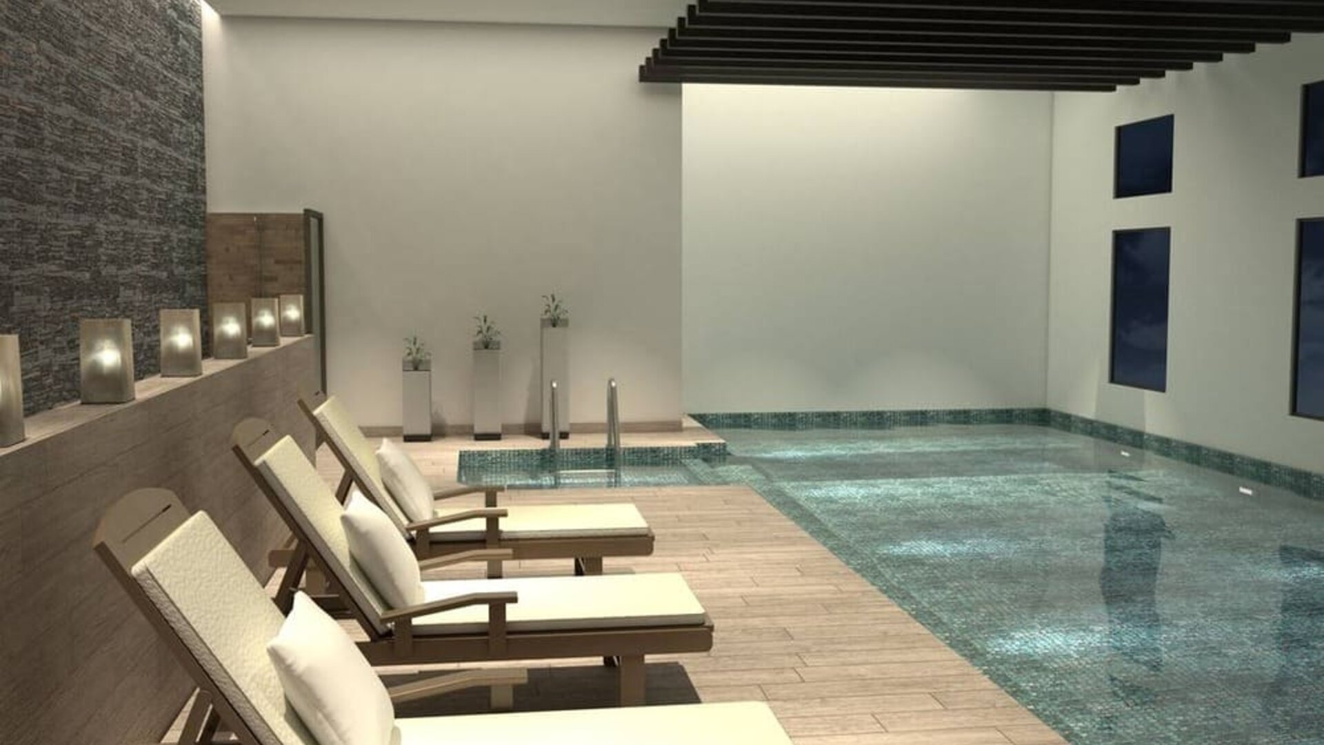 Stunning indoor pool with sun beds at Doubletree By Hilton Toluca.