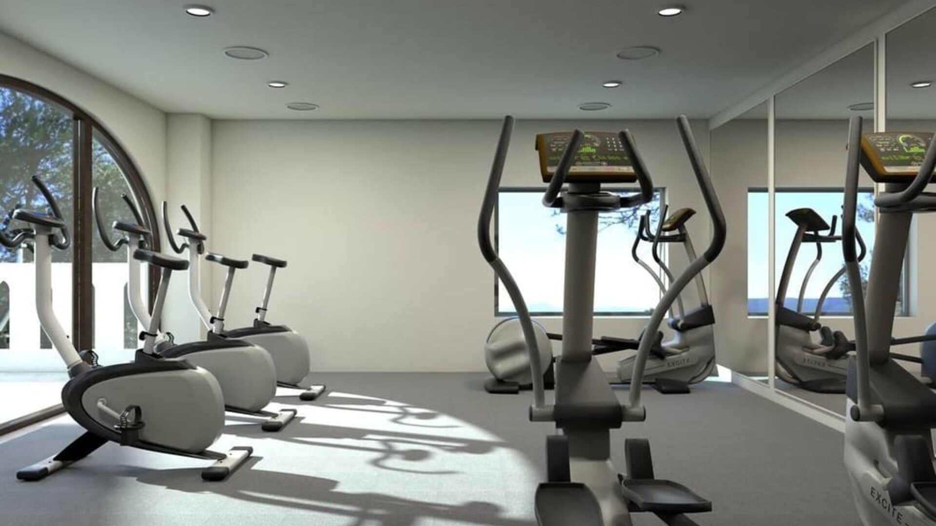 Well equipped fitness center with stationary bikes at Doubletree By Hilton Toluca.