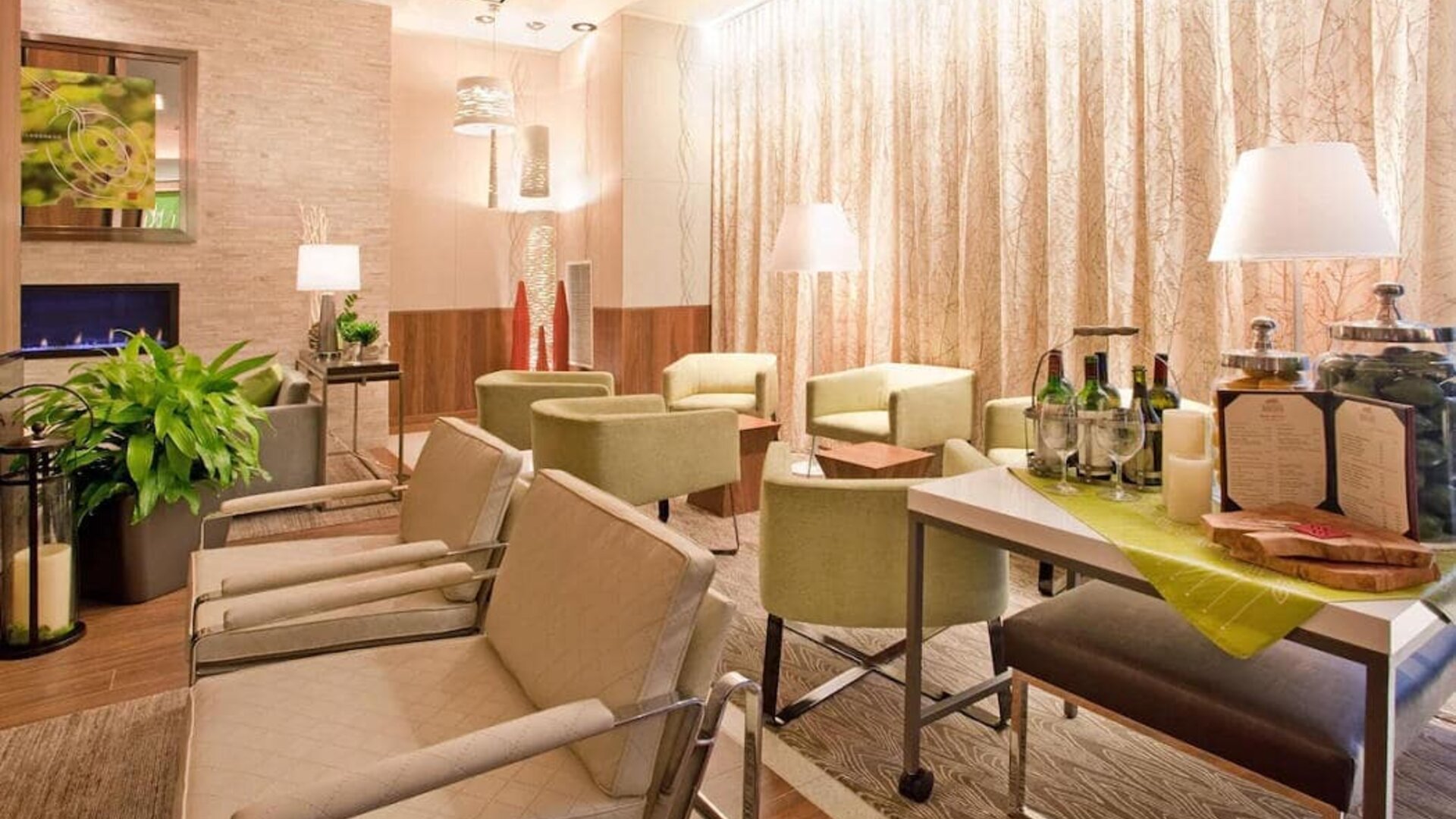 The lounge in the hotel’s reception area, with comfortable seating and small tables.