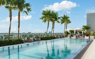 Relaxing pool area with sun chairs at The Altair Hotel Bay Harbor.
