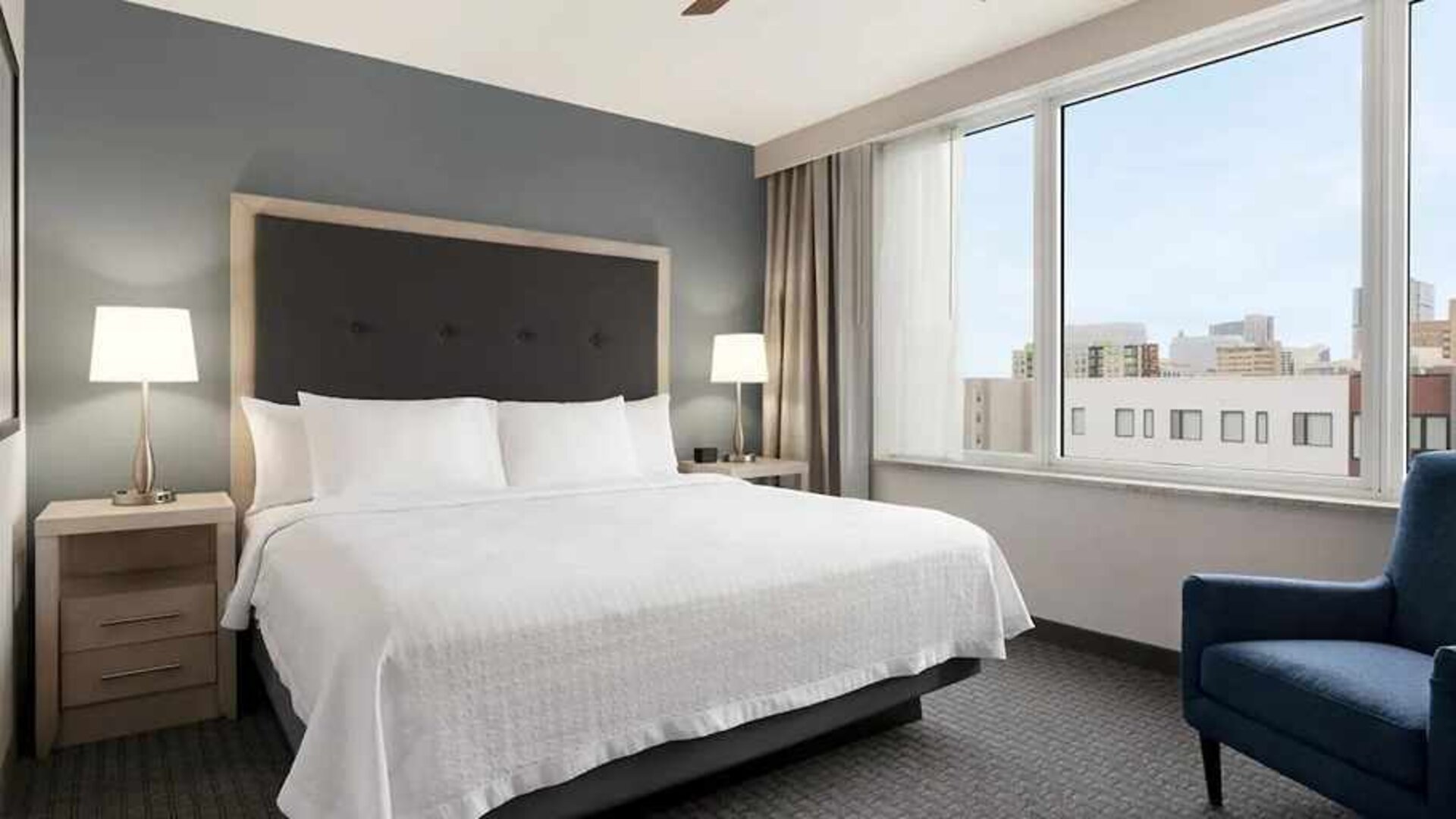 Spacious king suite with work area and TV at Homewood Suites by Hilton University City.