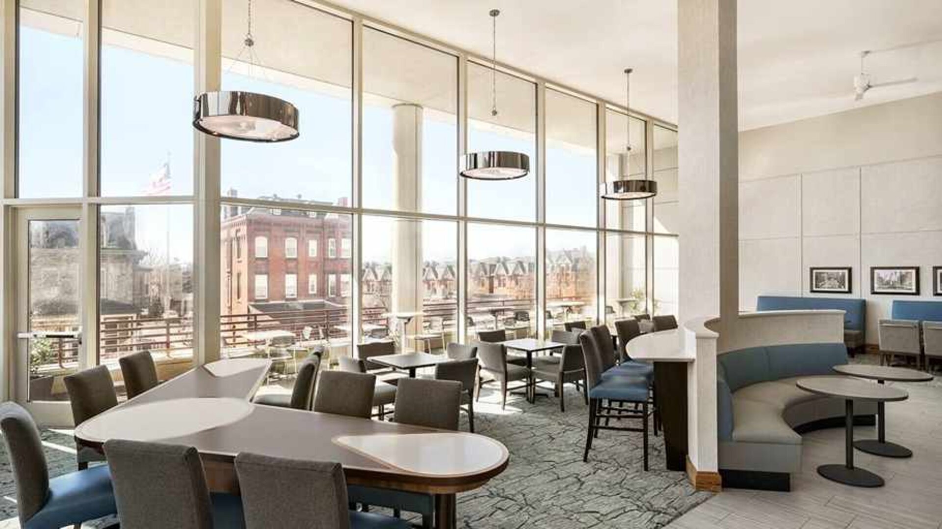 Comfortable lounge and coworking space with lots of natural light at Homewood Suites by Hilton University City.