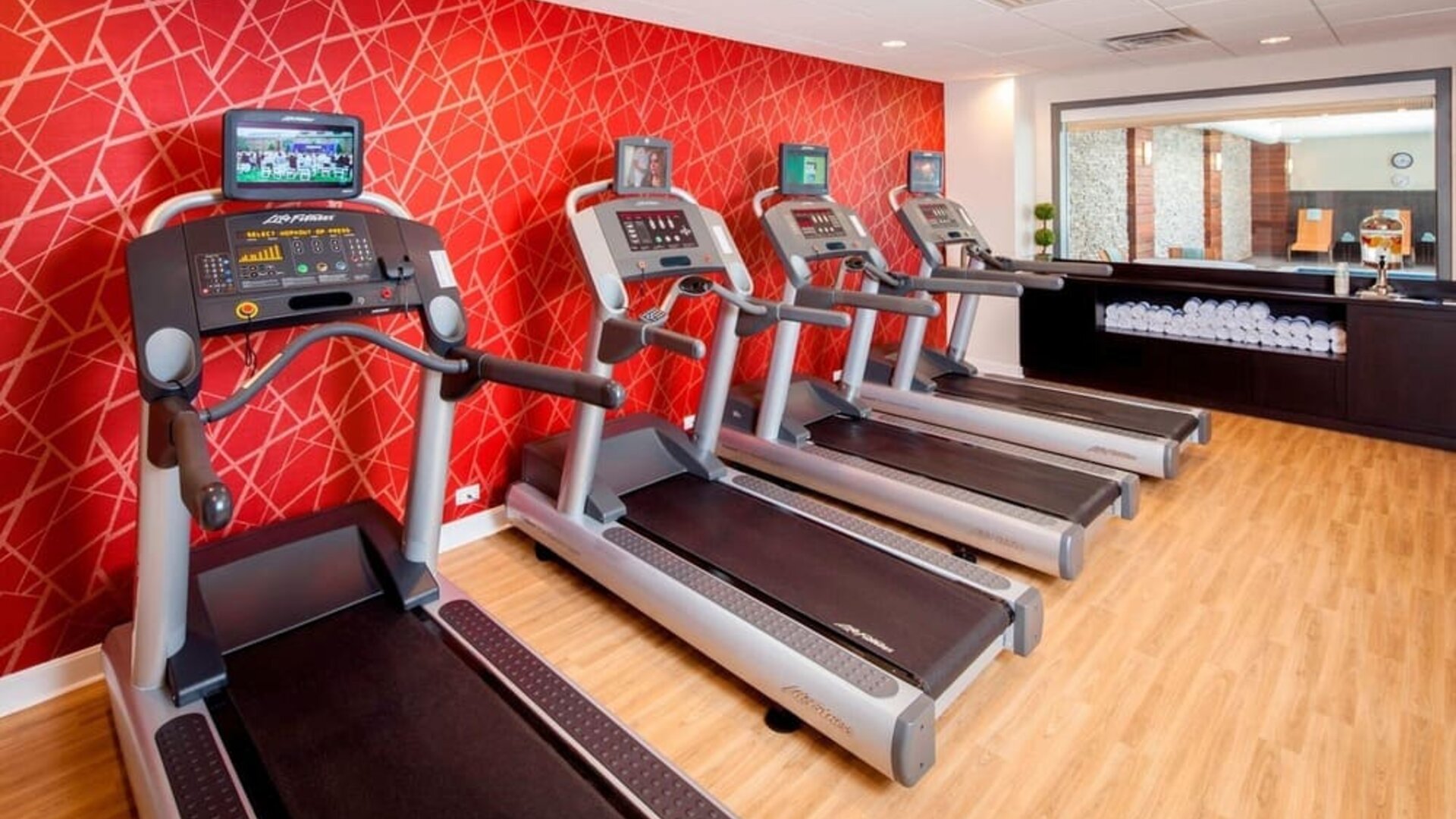 Well equipped fitness center at Courtyard By Marriott Boston Brookline.