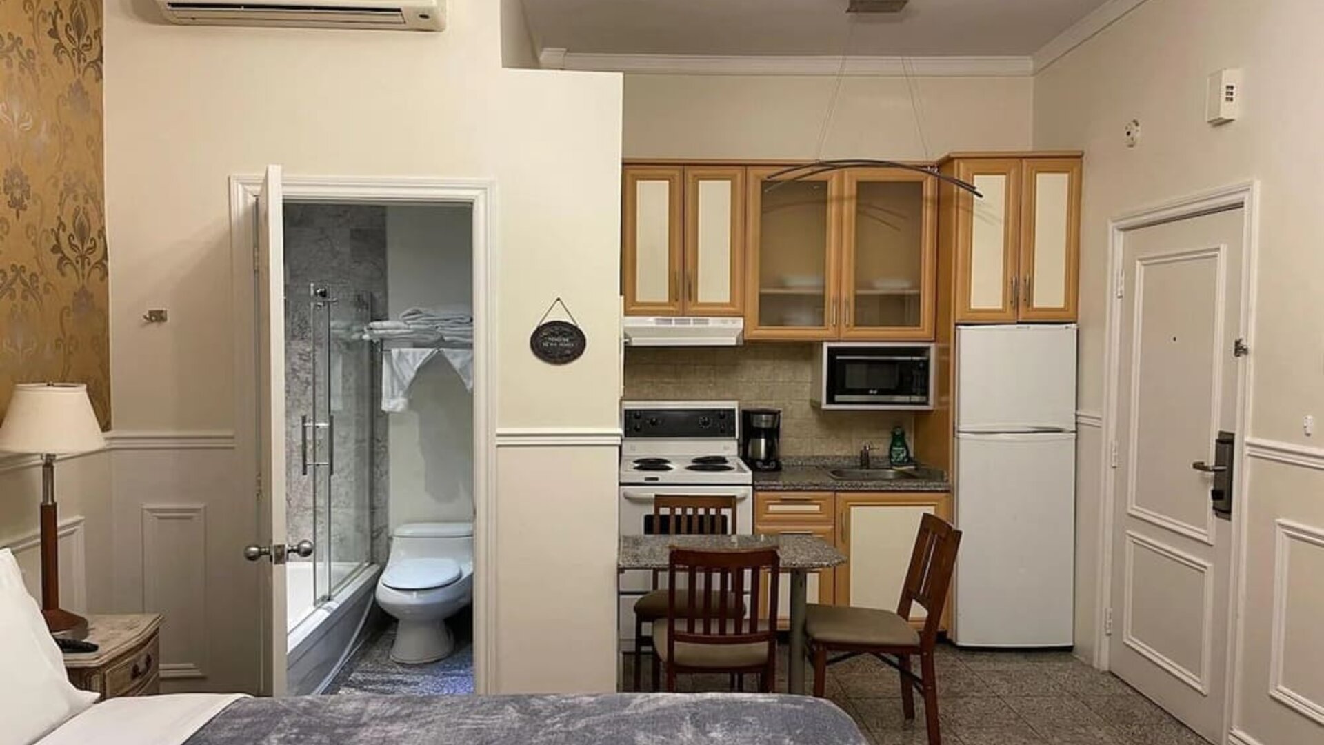 Delux king room with private bathroom and kitchenette at Parc Suites Hotel.