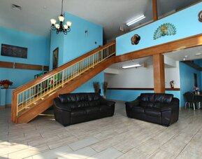 Lobby area at Coratel Inn & Suites By Jasper Newton.