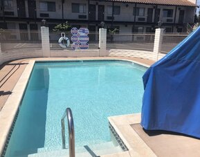 Refreshing outdoor pool at Cozy Inn.