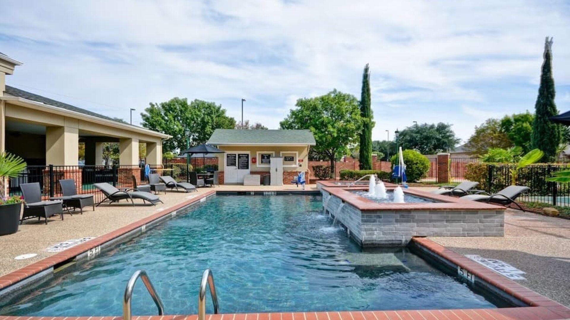 Stunning outdoor pool at Homewood Suites By Hilton Dallas-Lewisville.