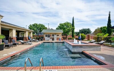 Stunning outdoor pool at Homewood Suites By Hilton Dallas-Lewisville.