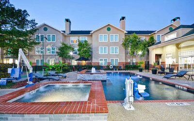 Luxurious pool area with jacuzzi hot tub at Homewood Suites By Hilton Dallas-Lewisville.