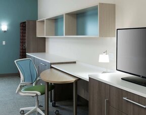 Day room with business desk at Home2 Suites By Hilton Cape Canaveral Cruise Port.