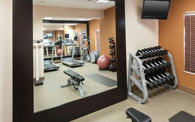Fitness center at Homewood Suites By Hilton Miami Airport-Blue Lagoon.