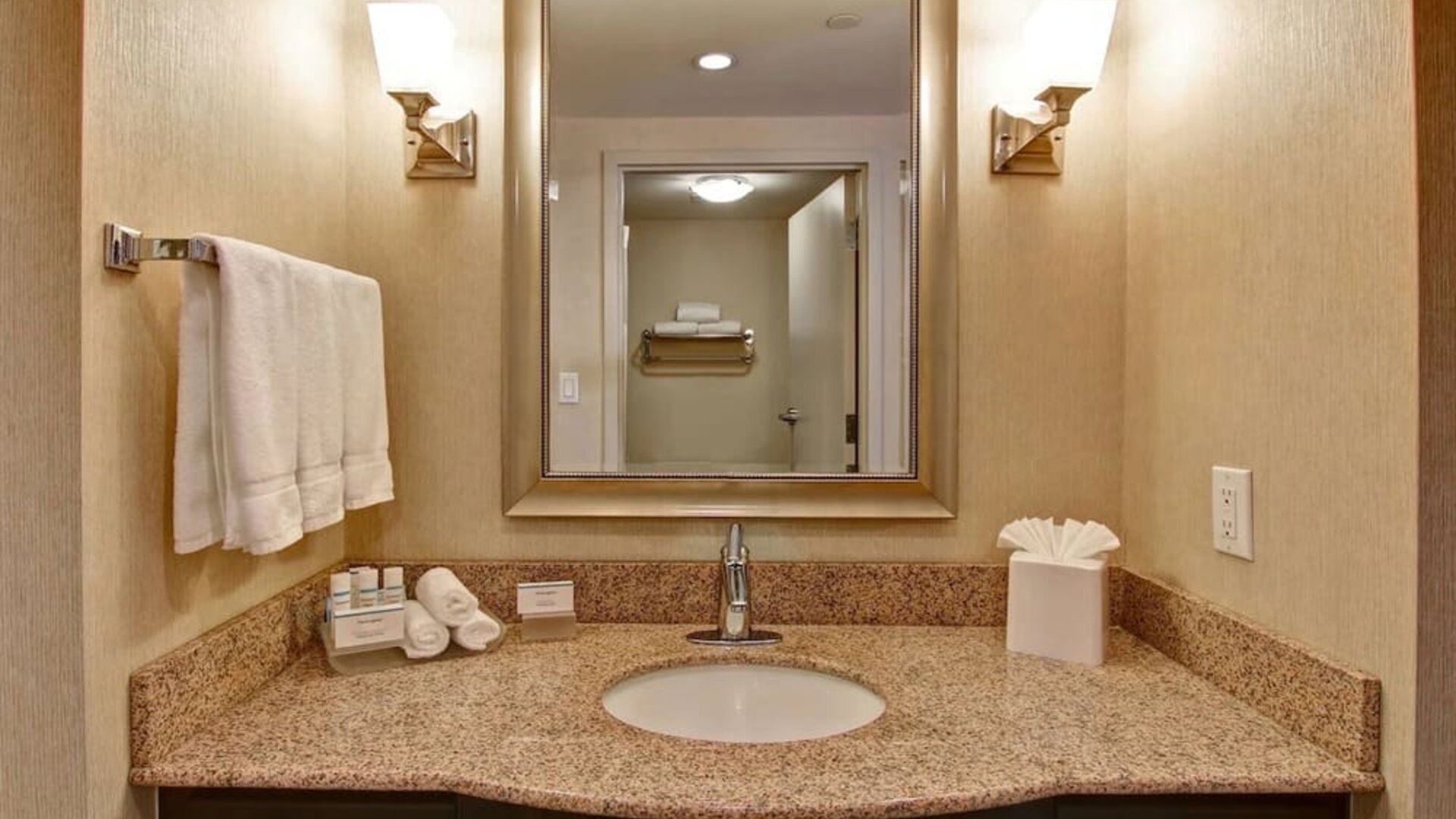 Guest bathroom with shower at Homewood Suites By Hilton Burlington.