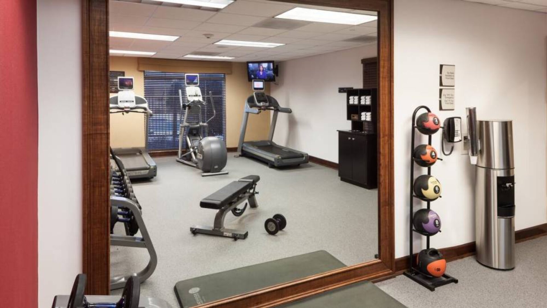 Well equipped fitness center at Homewood Suites By Hilton Denton.