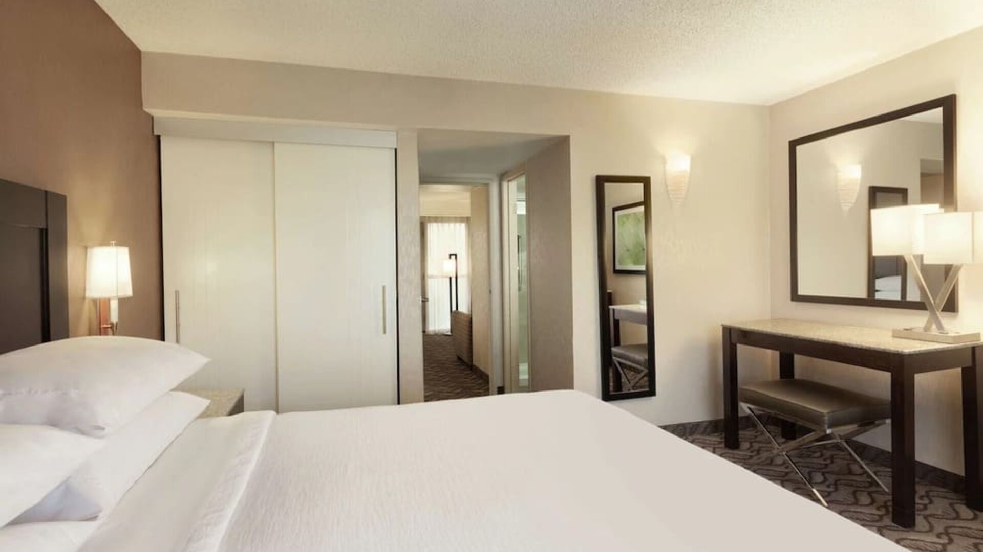 King bed with work space at Embassy Suites By Hilton Arcadia Pasadena Area.