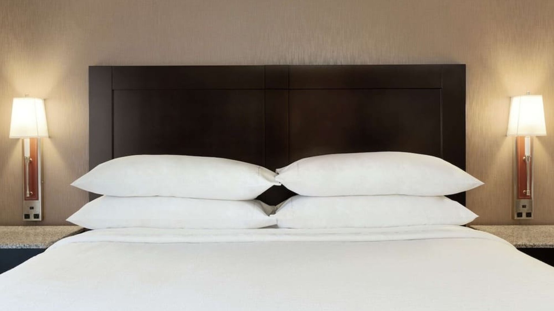 Delux king room with natural light and plush bedding at Embassy Suites By Hilton Arcadia Pasadena Area.