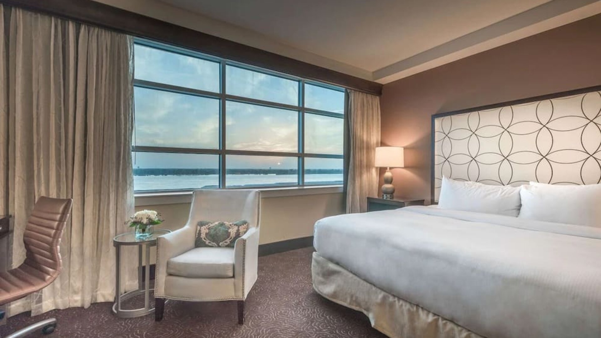 Delux king room with natural light at Hilton Baton Rouge Capitol Center.