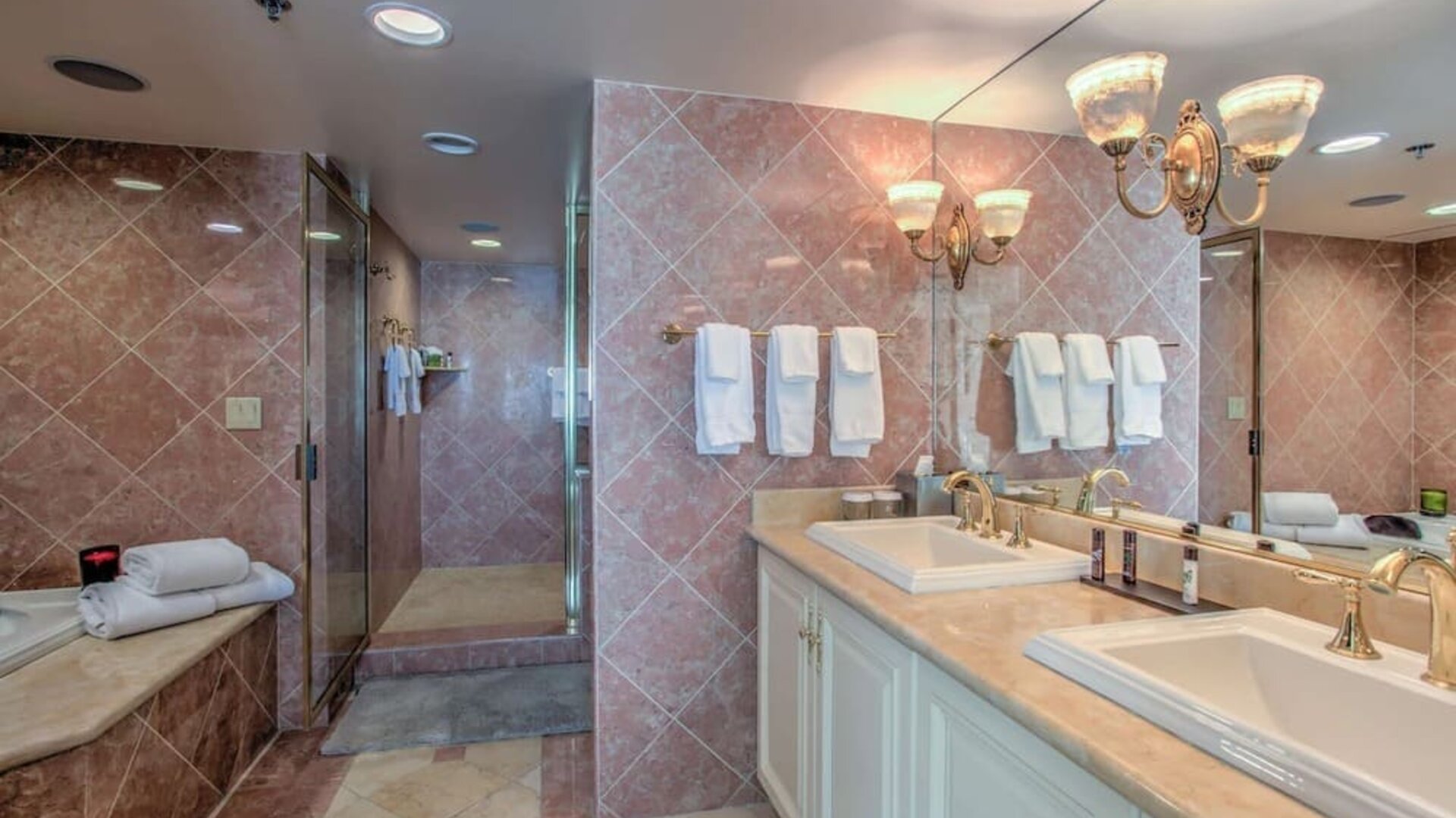 Guest bathroom with shower at Embassy Suites By Hilton Convention Center Las Vegas.