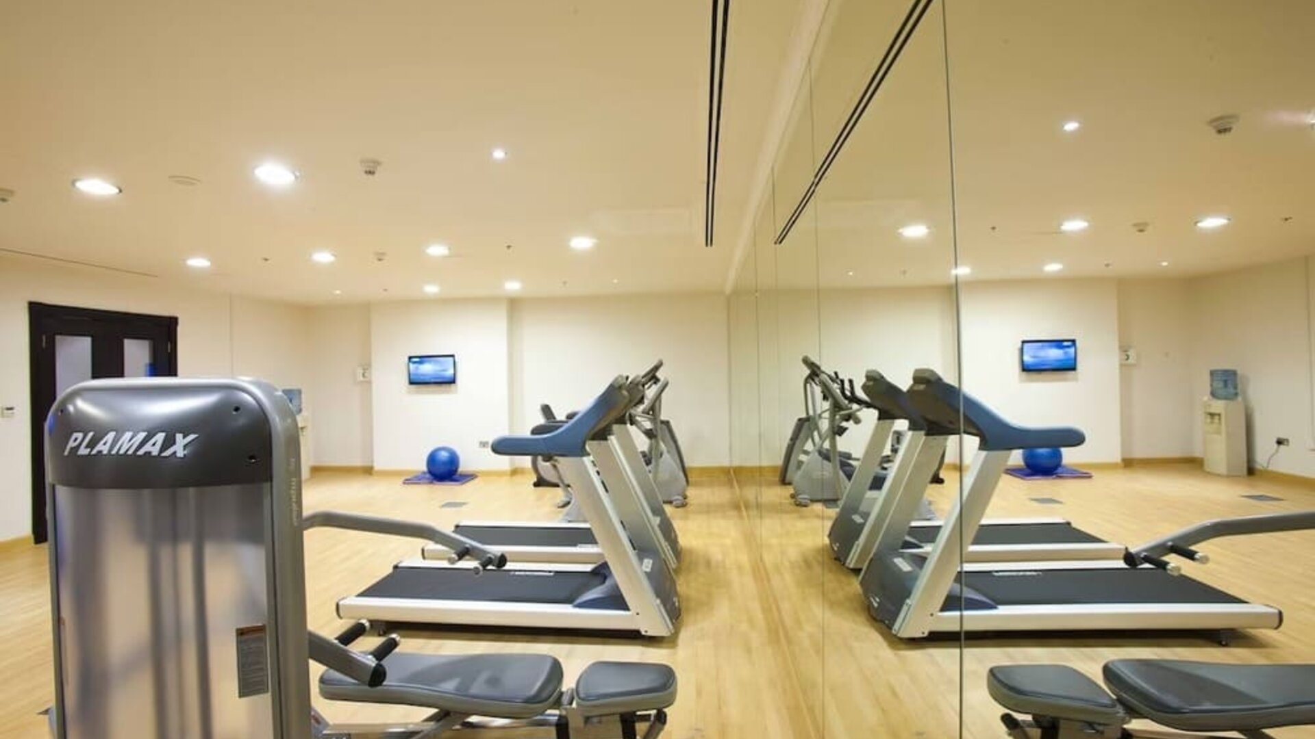 Equipped fitness center at Millennium Central Doha.