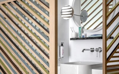 Guest bathroom with shower at OKKO Hotels Nice Aéroport.